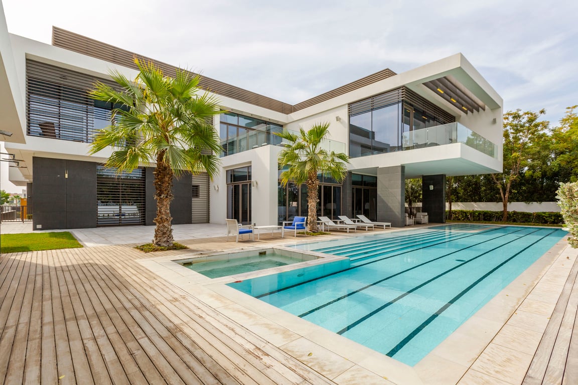 White and Brown Concrete Building Near the Swimming Pool